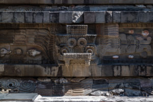 The face of Tlaloc repeats with Quetzalcoatl on the main temple.